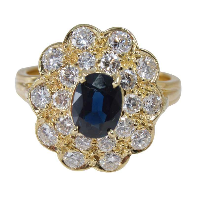 STYLE / REFERENCE: Classic Design
METAL / MATERIAL: 18 Karat Yellow Gold
CIRCA / YEAR: Contemporary
STONES / WEIGHT: Natural Blue Sapphire 0.90ct. and
20  Round Brilliant Diamonds 0.85ct total weight
SIZE:  7

A bright, clear blue, faceted oval