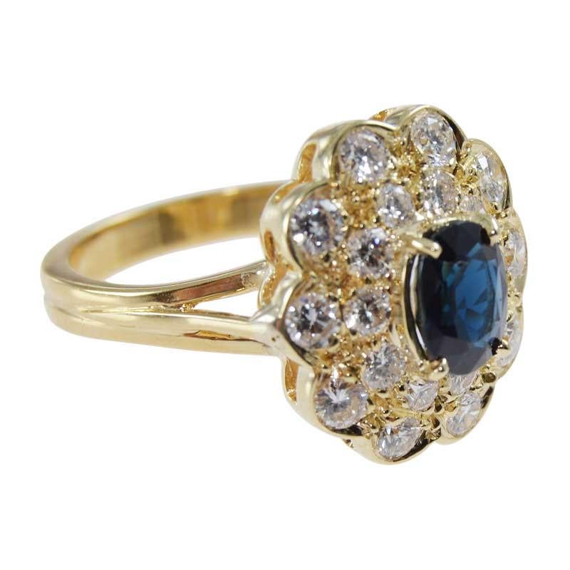 Oval Cut Natural Blue Sapphire in a Double Diamond Halo Set in 18Kt Yellow Gold Ring For Sale