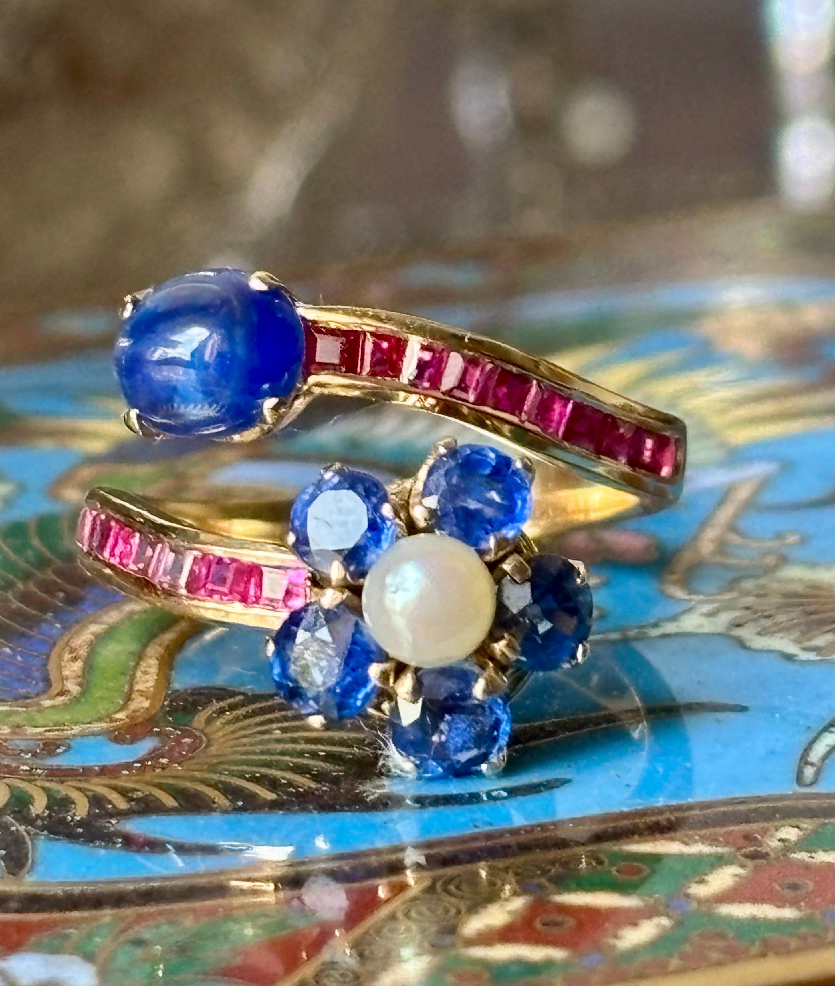 Contemporary Natural  Blue Sapphire, Ruby and pearl  Bypass Ring in 18 Karat Gold For Sale