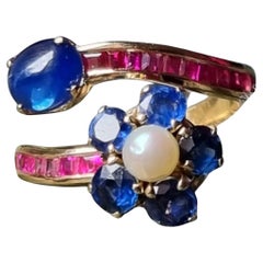 Natürlich  Blauer Saphir, Rubin und Perle  Bypass-Ring aus 18 Karat Gold