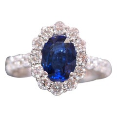 Natural Blue Sapphire Set in a Custom Made Nature Inspired Flower Halo Ring