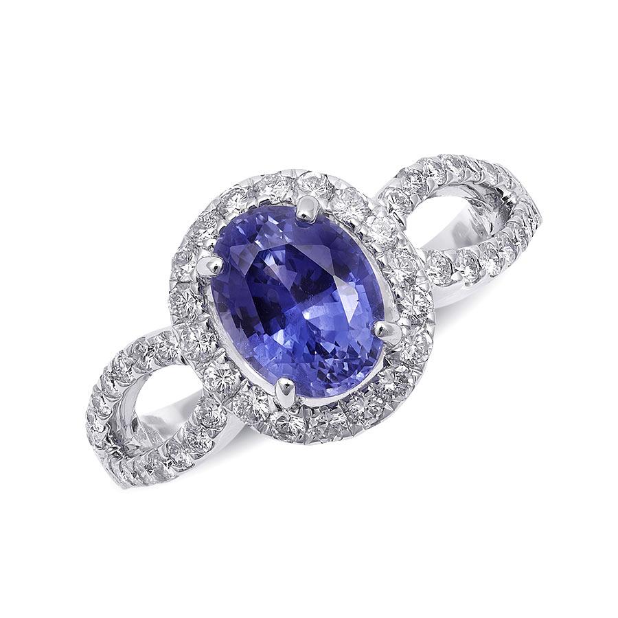 Discover the enchanting beauty of this 14K white gold ring, featuring a captivating natural blue sapphire complemented by dazzling diamonds. The rich blue hue of the sapphire, highlighted by the brilliant diamonds, makes this ring a truly exquisite