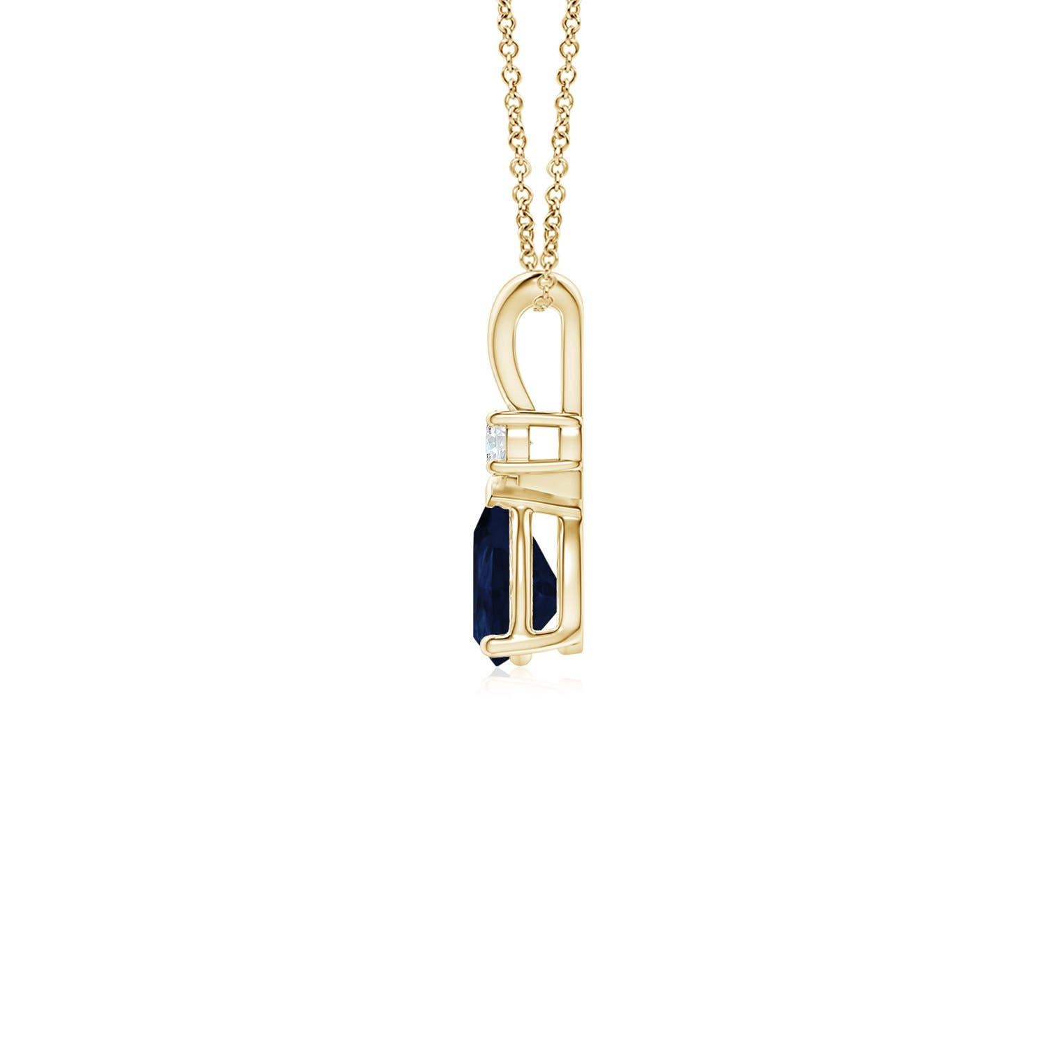This classic solitaire pendant features a pear-shaped sapphire secured in a prong setting. A brilliant round diamond sits atop the blue gemstone adding to the design's charm. Simple yet appealing, this sapphire pendant in 18k yellow gold is crafted