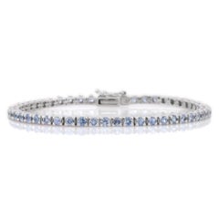 Bracelet tennis en or 18 carats avec saphir bleu naturel