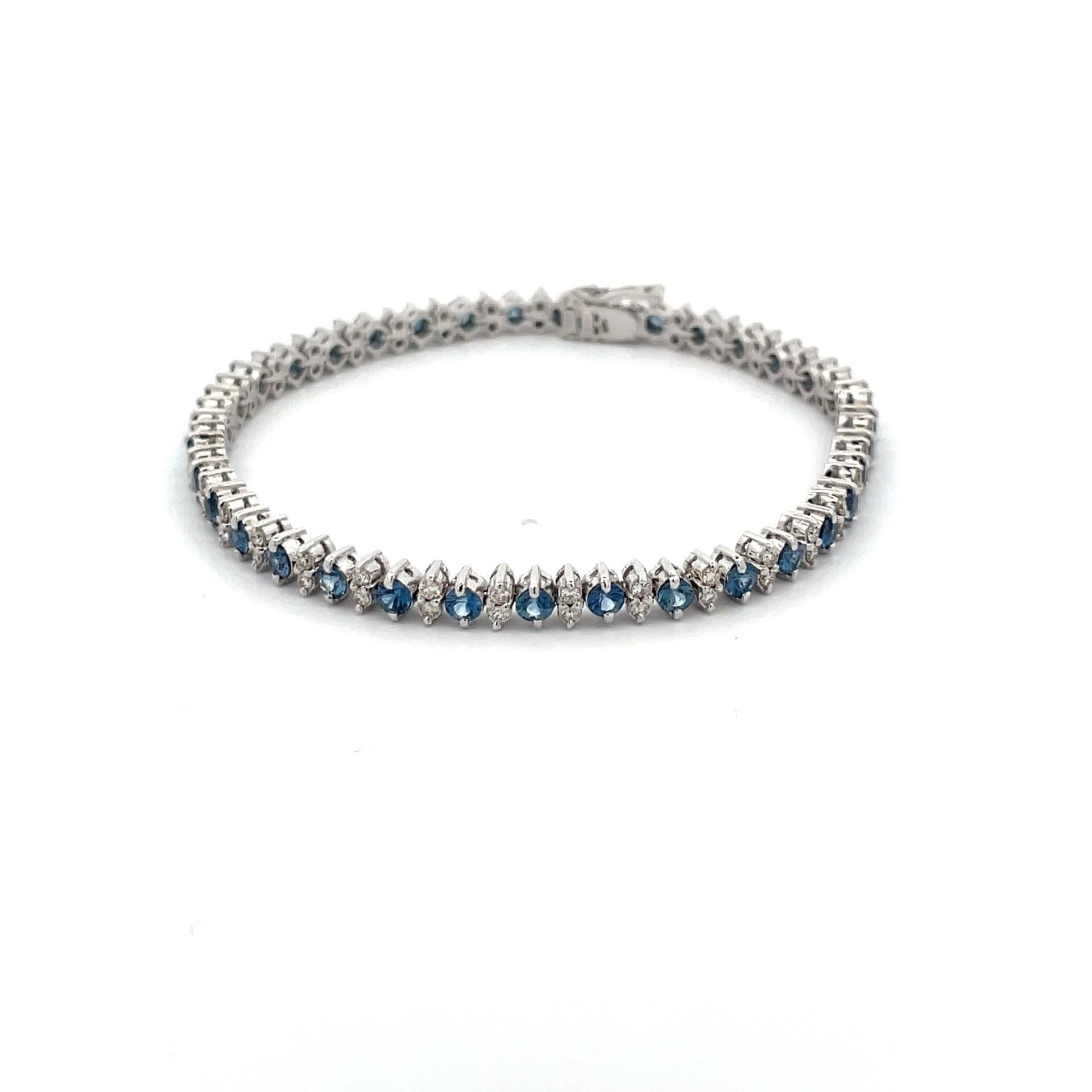 Alternative natural blue sapphire and brilliant cut diamond (in a marquis shape) bracelet in 18kt white gold. The colour combination of diamonds and sapphires is absolutely gorgeous.

35 natural blue sapphires weighing 4.20ct total weight

70