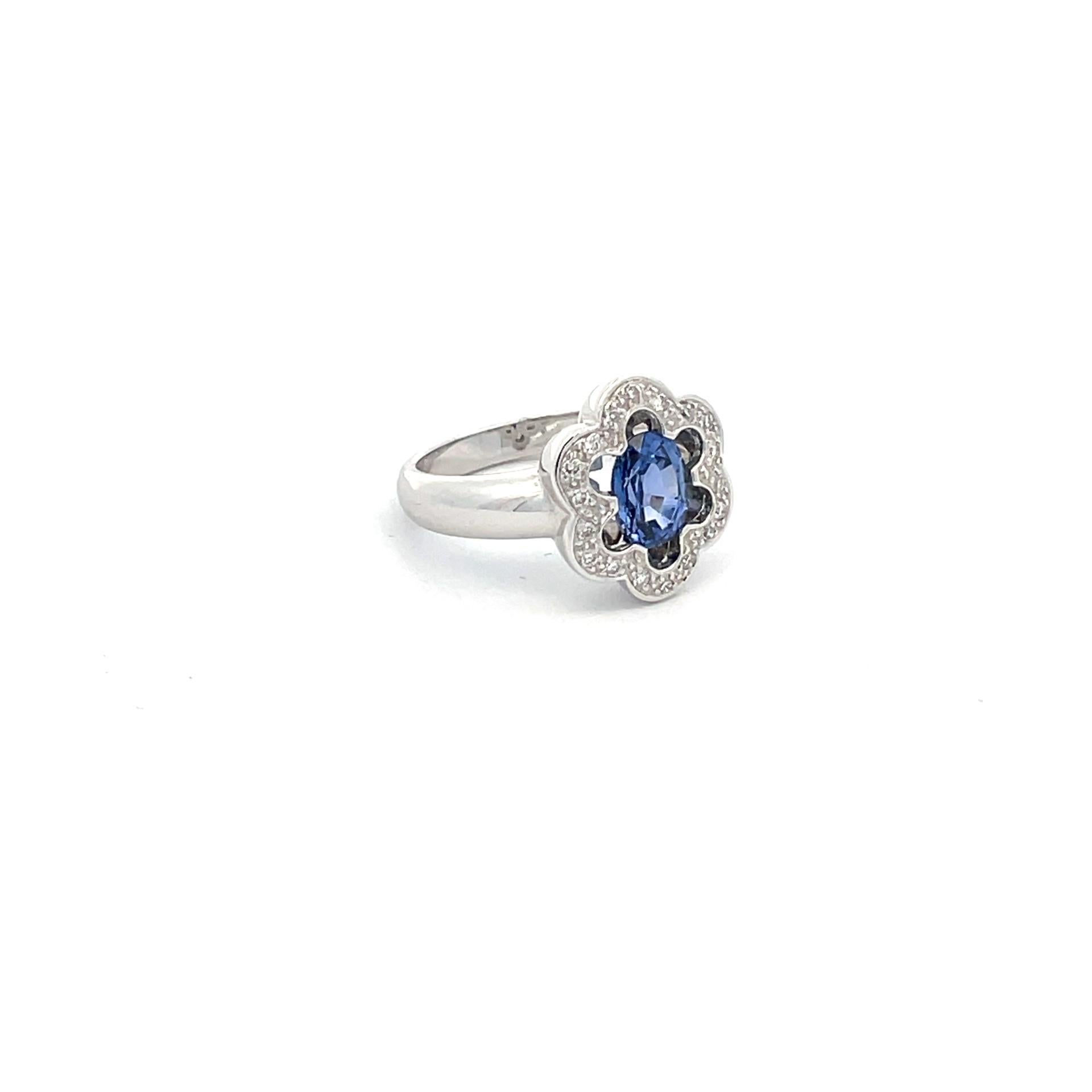 Blooming with sophistication this solitaire flower ring with natural blue sapphire center, natural white diamonds scalloped halo in 18kt white gold.

1 natural blue sapphire 1.53ct total weight

12 brilliant cut natural diamonds 0.84ct total