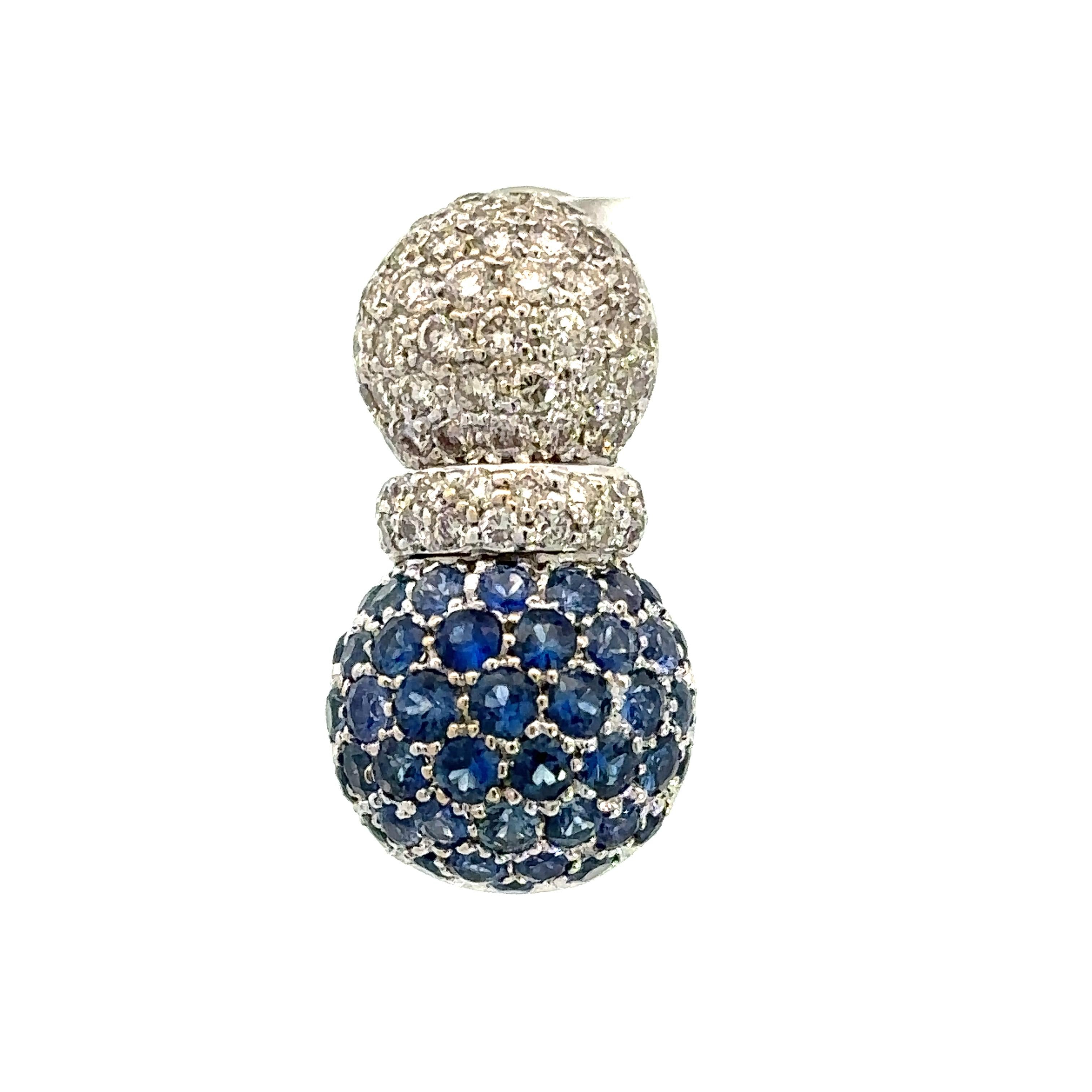 A pair of 18kt white gold Pineapple earrings set with natural blue sapphires and white diamonds with a beautiful open gallery motif, with a post and omega clip system.

84 natural blue sapphires 2.98ct total weighty

118 brilliant cut diamonds