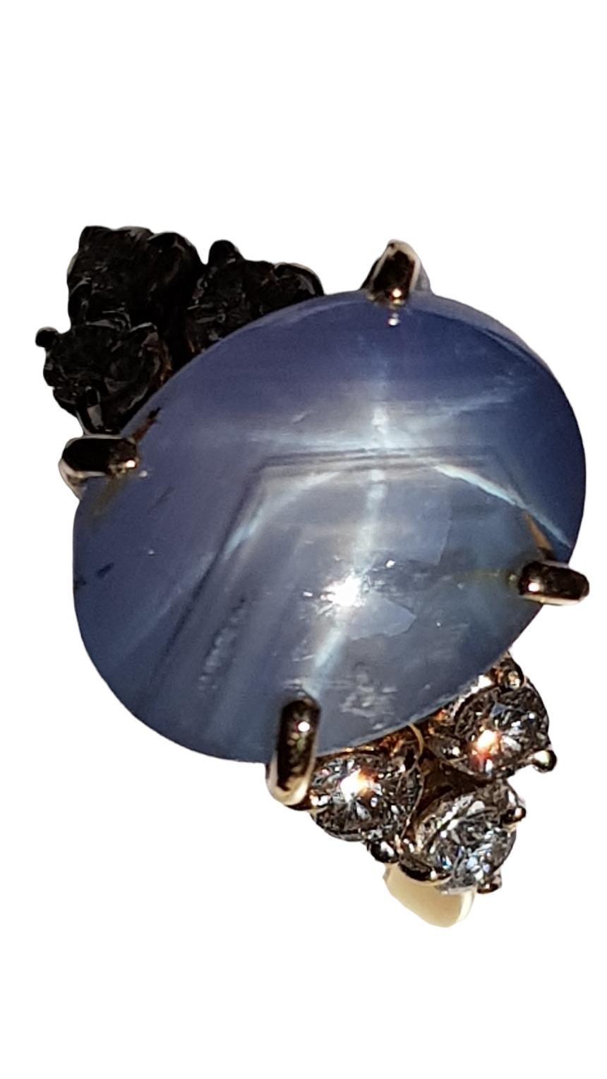 Vintage Natural Blue Star Sapphire Sri Lanka origin  untreated, unheated. GIA certified report number  7481025175 approx. 13.11 carats weight  and Diamond Ring. 
A high-profile cabochon sapphire, weighing approx. 13.11  carats ( 13.24X10.30X8.90mm-L