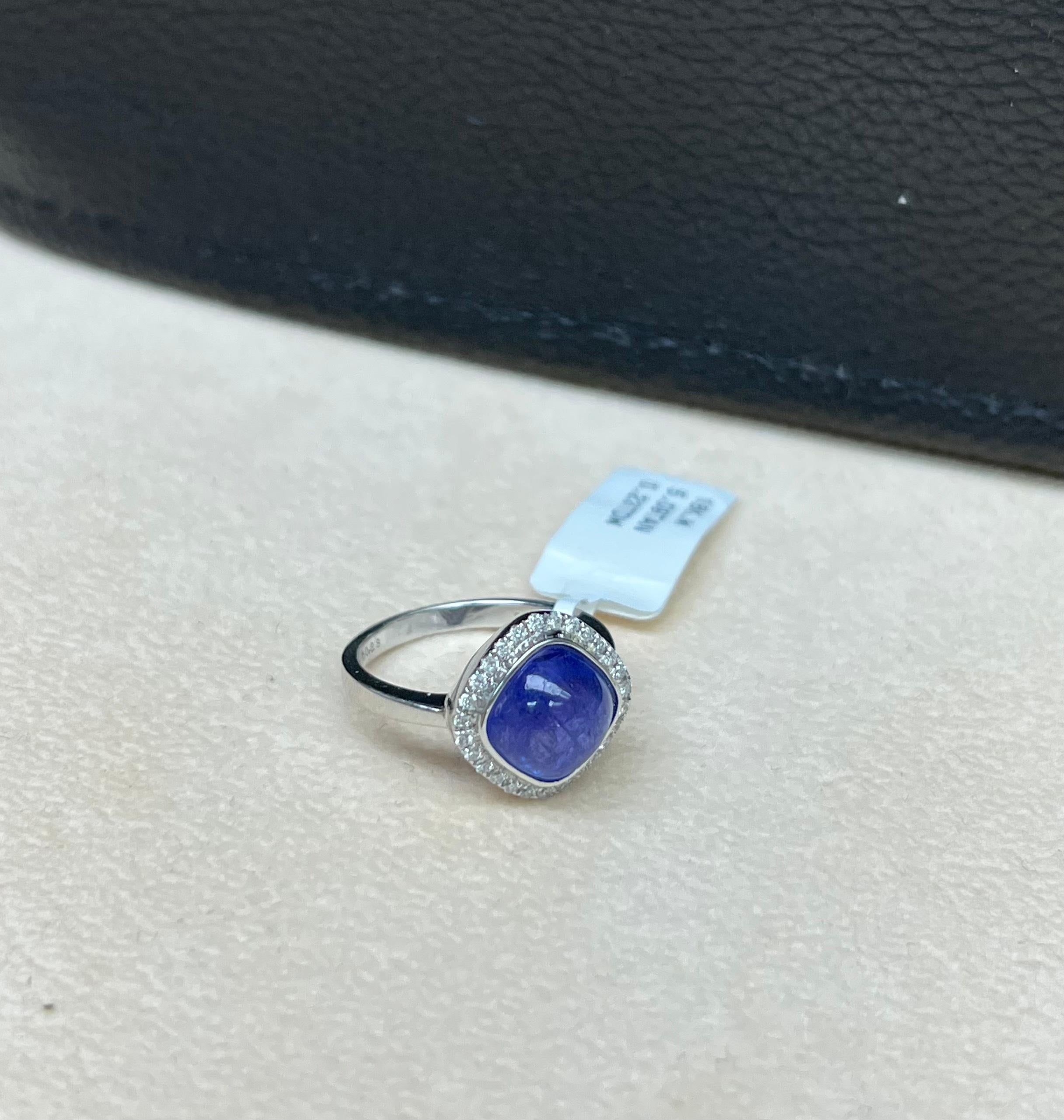 Gorgeous Natural Vivid Blue Tanzanite 5.09 Total Carat Weight

Natural Round White Diamonds .23 Total Diamond Weight 

18K Solid White Gold 

Comfortable fit and quality made

Size: 6.5 

Sizable 

Free Insured Shipping 