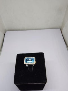 Natural Blue Topaz 5.70cts & Diamond 0.20cts Ring in 18k Gold