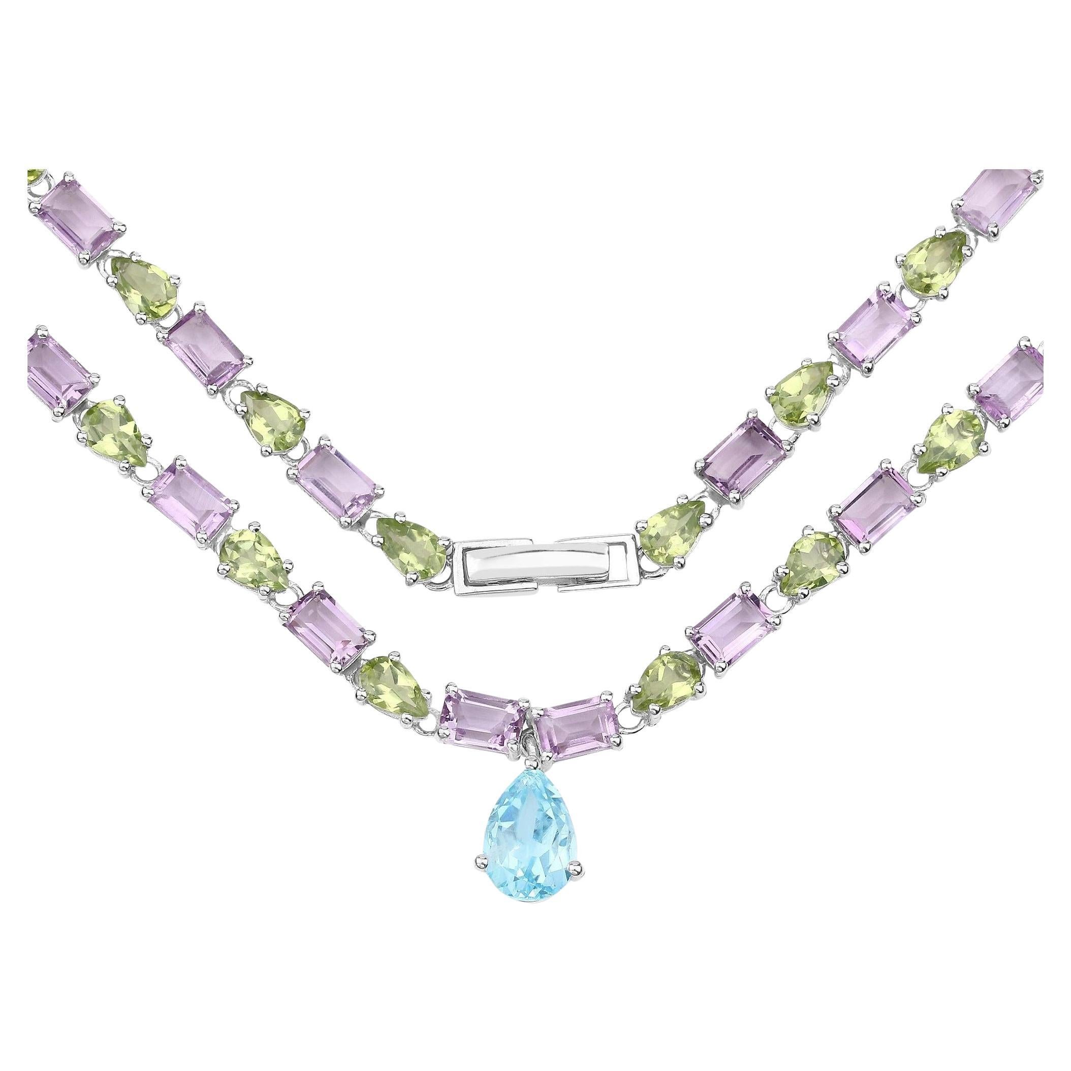 Collier d'éternité en topaze bleue, améthyste et péridot 32 carats en argent