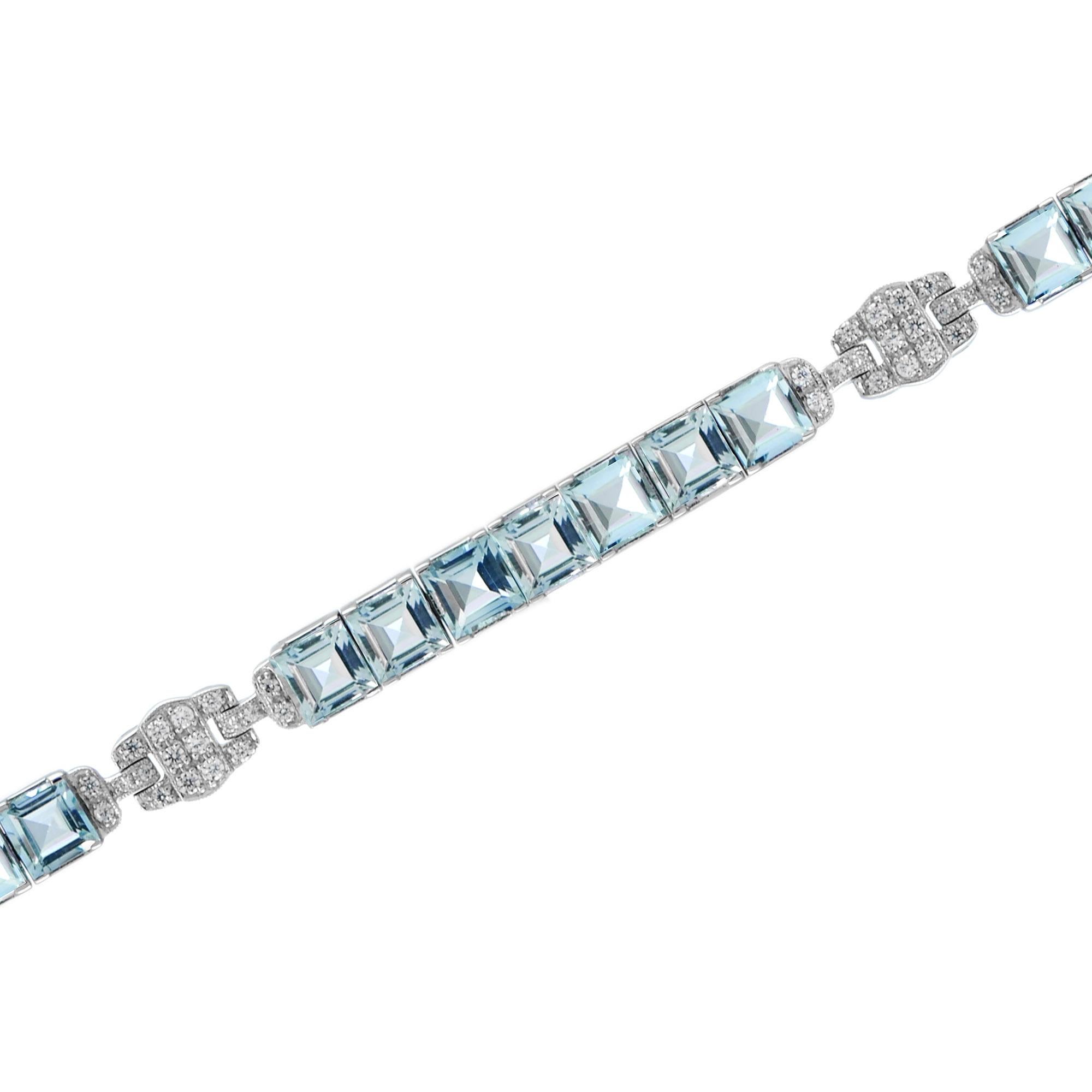 Enjoy the bright hue of blue topaz on this white gold bracelet featuring glistening diamonds. A total of twenty one square shaped blue topaz and fifty four round cut diamond art set in this gorgeous bracelet in 18k white gold. 

Bracelet