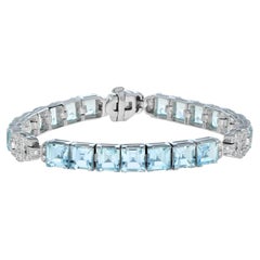 Bracelet en or blanc 18 carats avec topaze bleue naturelle et diamants