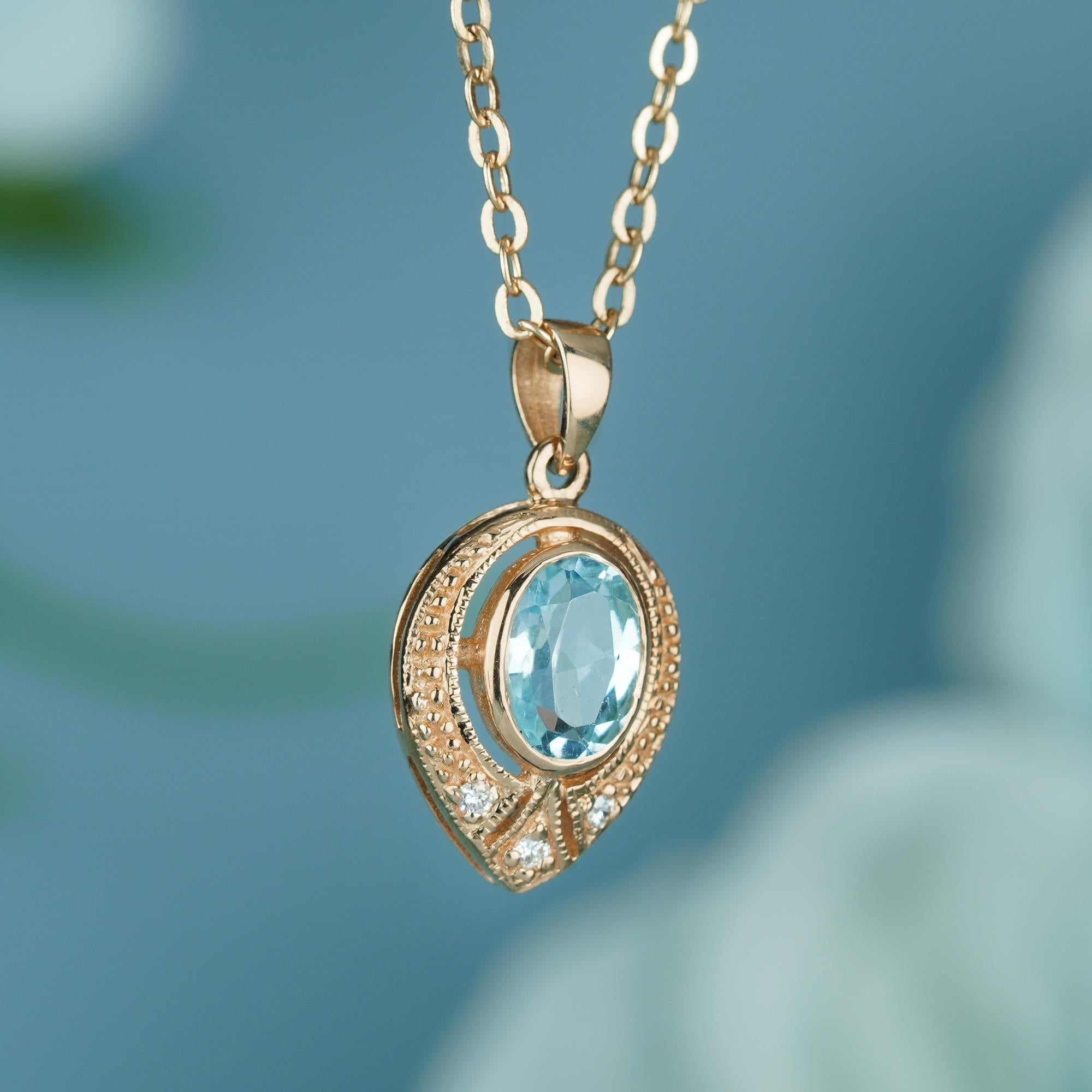 Edwardian Natural Blue Topaz and Diamond Vintage Style Pendant in solid 9K Yellow Gold For Sale