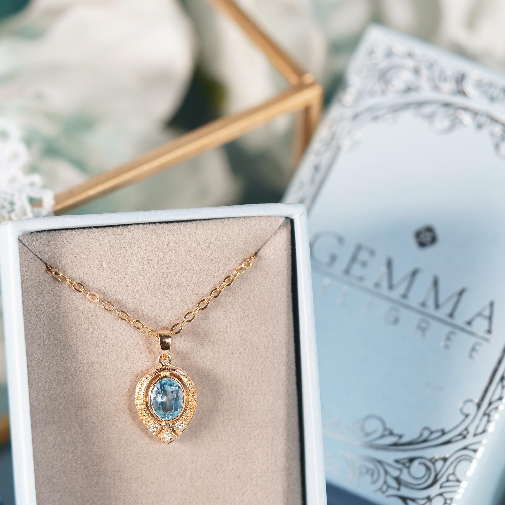 Women's Natural Blue Topaz and Diamond Vintage Style Pendant in solid 9K Yellow Gold For Sale