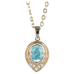 Natural Blue Topaz and Diamond Vintage Style Pendant in solid 9K Yellow Gold