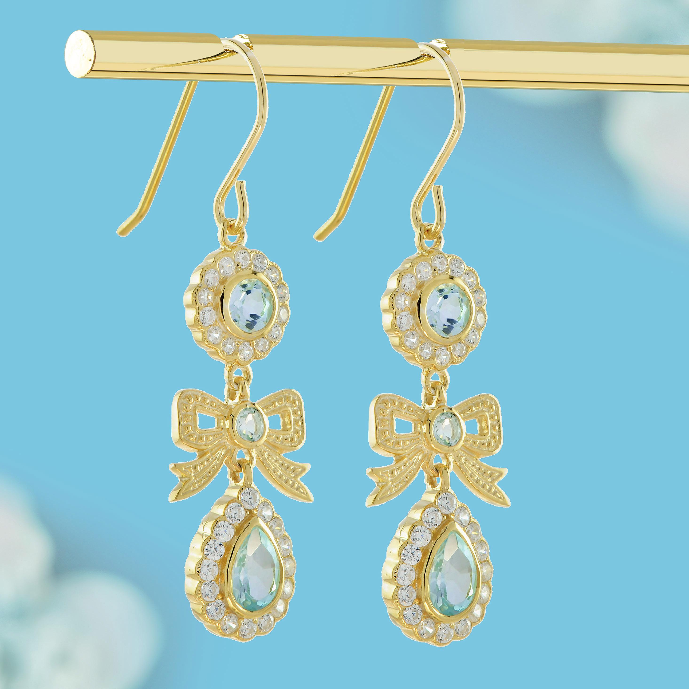 Edwardian Natural Blue Topaz and Diamond Vintage Style Ribbon Earrings in 9K Yellow Gold For Sale