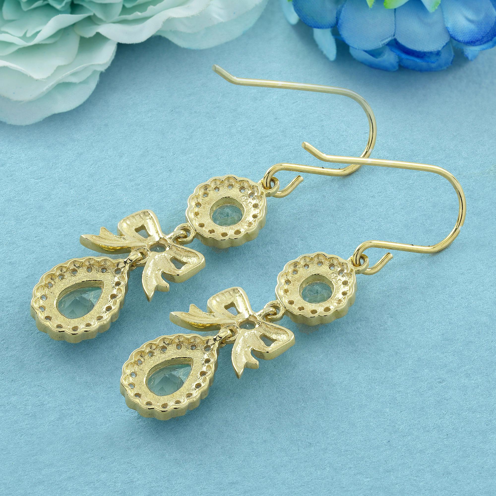 Oval Cut Natural Blue Topaz and Diamond Vintage Style Ribbon Earrings in 9K Yellow Gold For Sale
