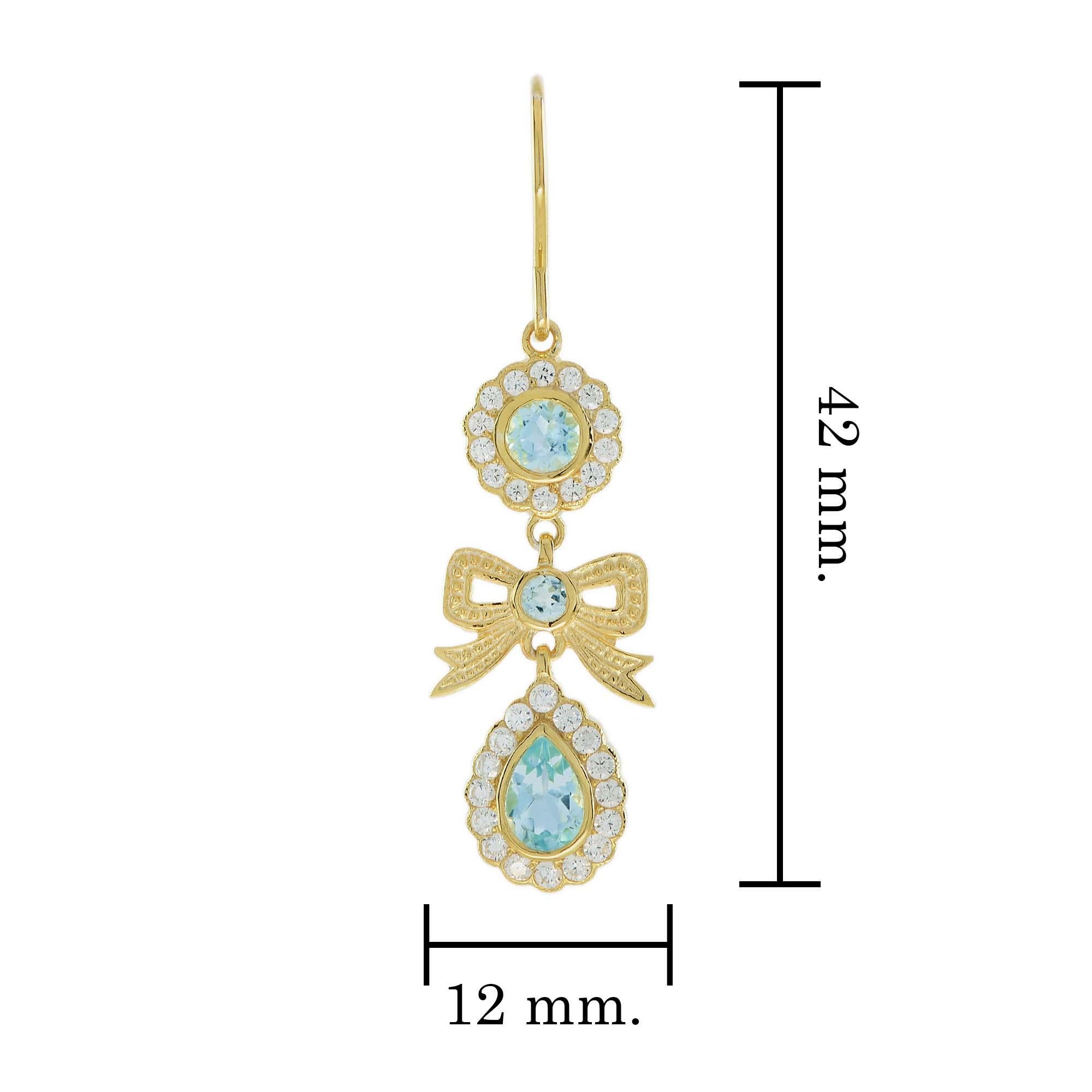 Natural Blue Topaz and Diamond Vintage Style Ribbon Earrings in 9K Yellow Gold In New Condition For Sale In Bangkok, TH