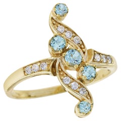 Ring aus massivem 9 Karat Gelbgold mit natürlichem blauem Topas und Diamant im Vintage-Stil