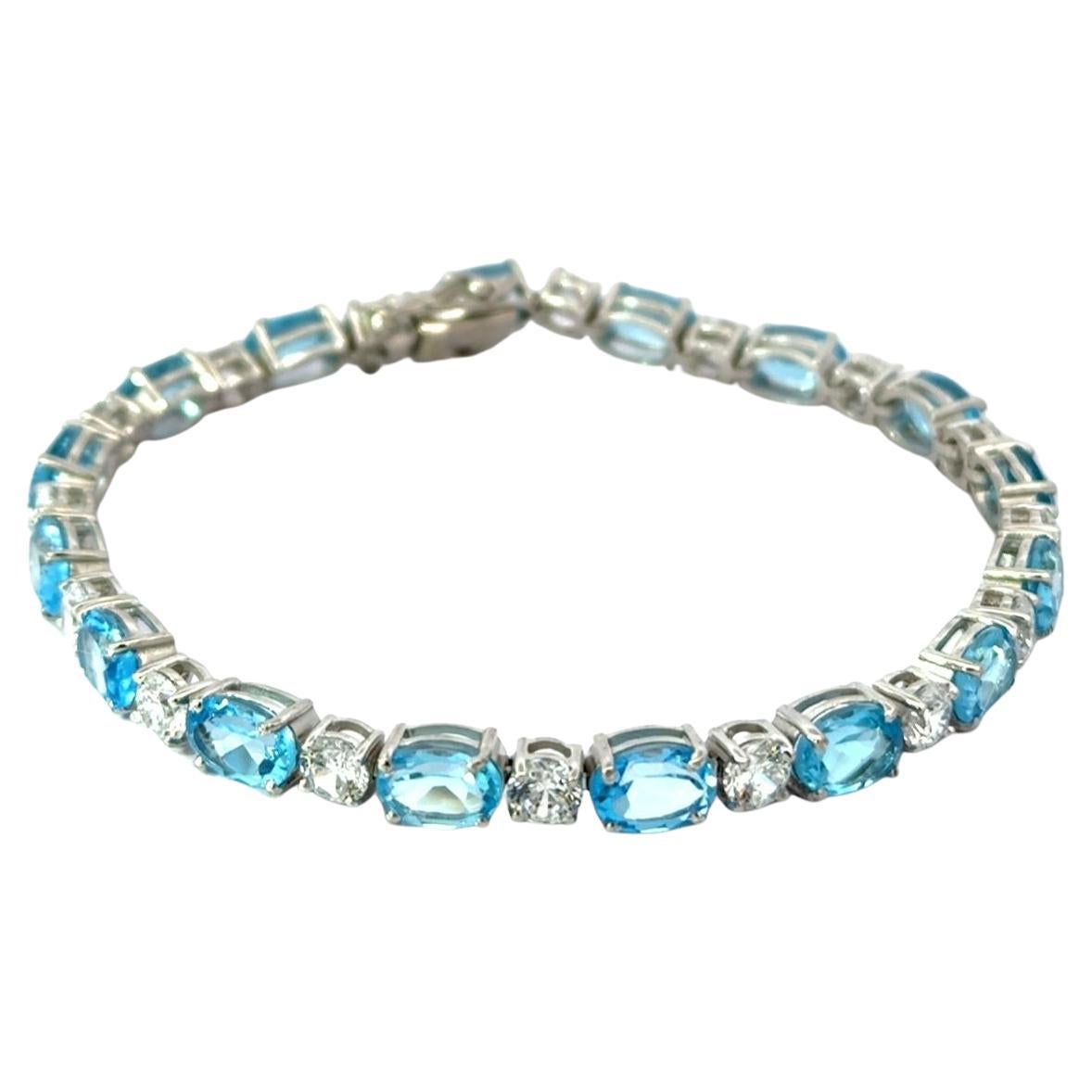 Natural Blue Topaz and CZ 15.3 Carat Silver Tennis Bracelet Jewelry Gift for Her For Sale