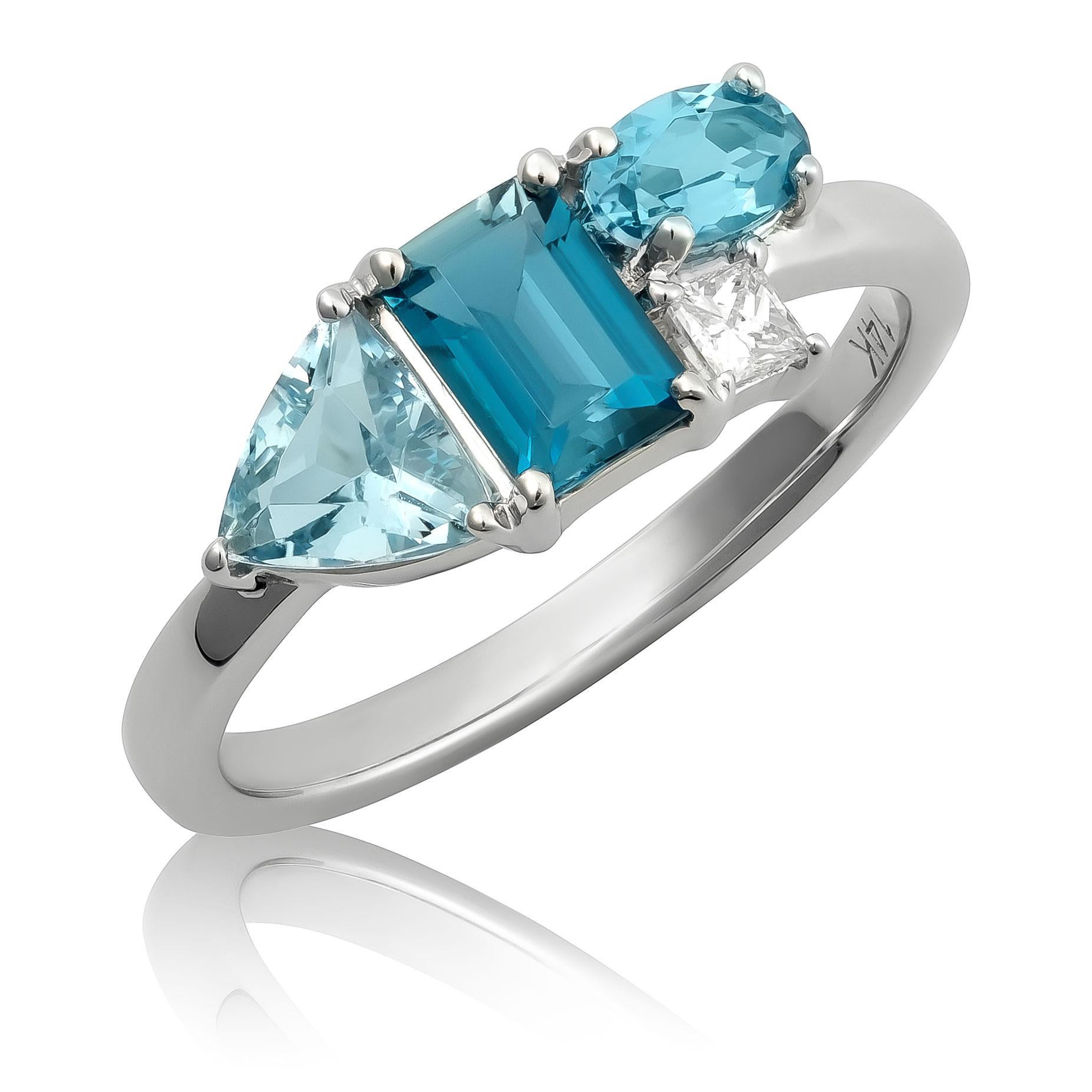 Descubre la serena belleza de este anillo de oro blanco de 14 quilates, con una armoniosa mezcla de topacio azul natural, aguamarina y diamantes. Los distintos tonos de piedras preciosas azules, acentuados por brillantes diamantes, crean un diseño