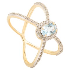 Bague croisée en or jaune 14 carats avec topaze bleue naturelle et diamants