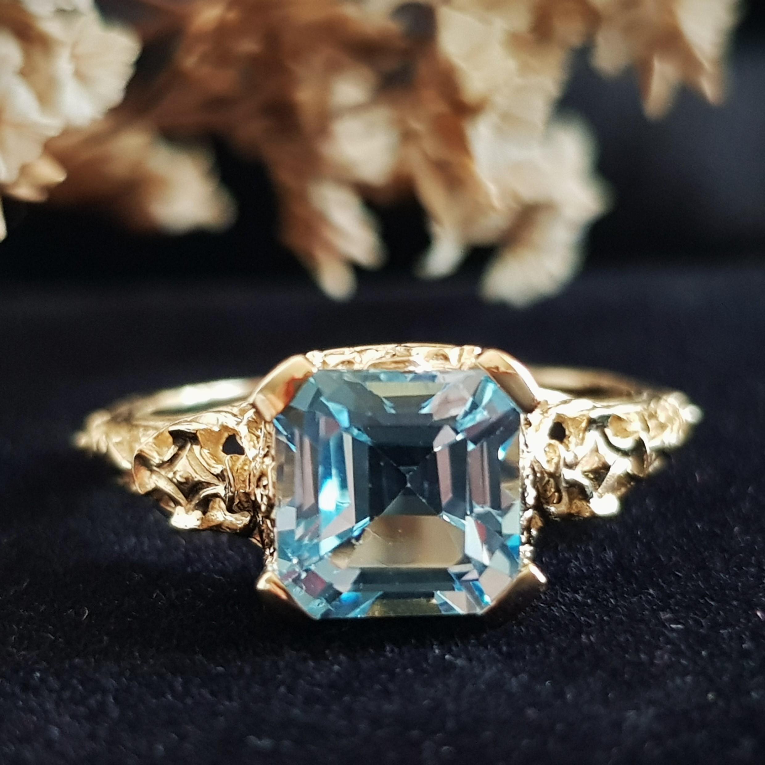 An Art Deco style filigree ring with 2.7 carats natural emerald cut blue topaz in the center. Filigree rings are timeless in style and can be enjoyed, cherished and handed down as precious family heirlooms.

Ring Information
Metal: 14K Yellow Gold –