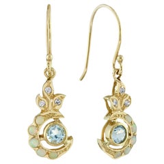 Orecchini pendenti floreali in stile vintage in oro 9K con diamante e topazio blu naturale.