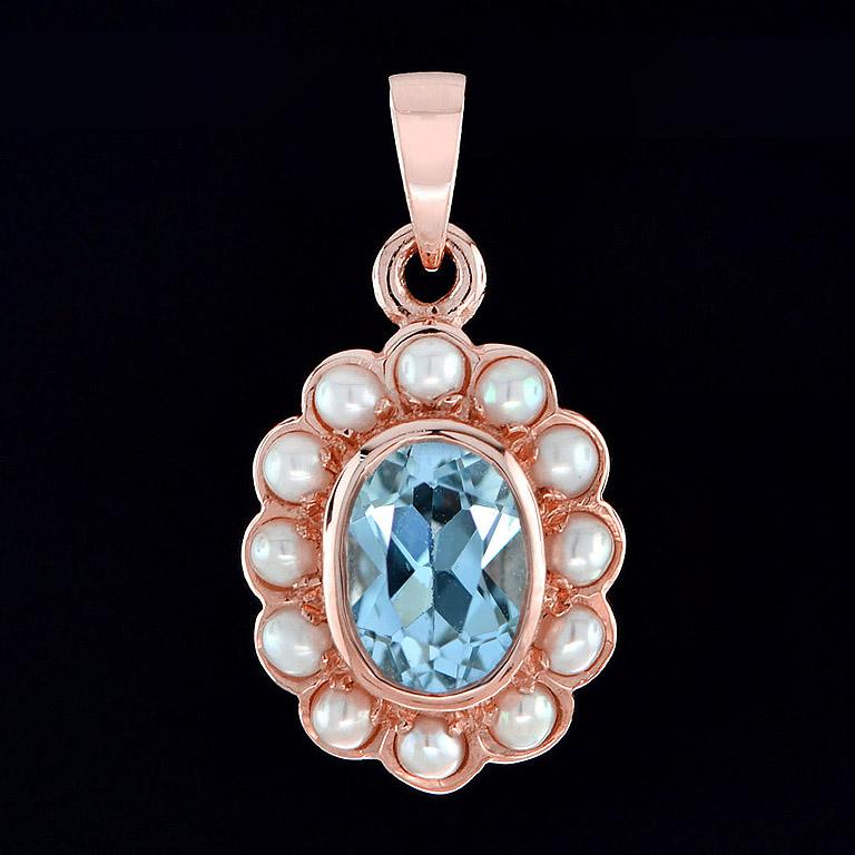 Crated in 9K rose gold, this delightful pendant features a rich blue 2.7 Carat Blue Topaz as its center. It is complemented by a cluster of 16 pearls. This breathtaking pendant would make a wonderful gift for someone you love or