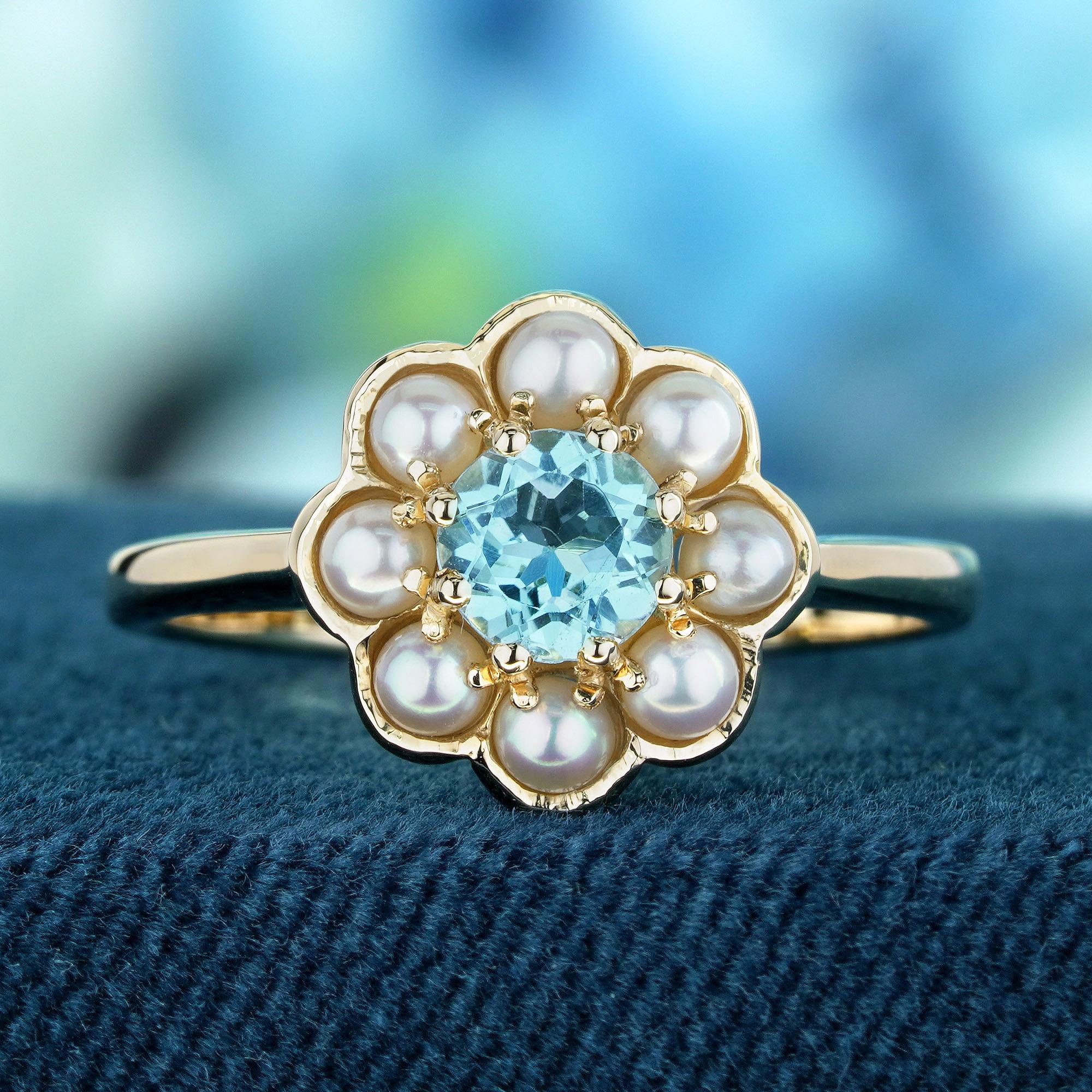 Experience timeless elegance with our blue topaz and pearl vintage floral ring in yellow gold. This stunning piece showcases a cluster of white pearls gracefully surrounding the blue topaz nestled at its center in a floral design. Elevate your style