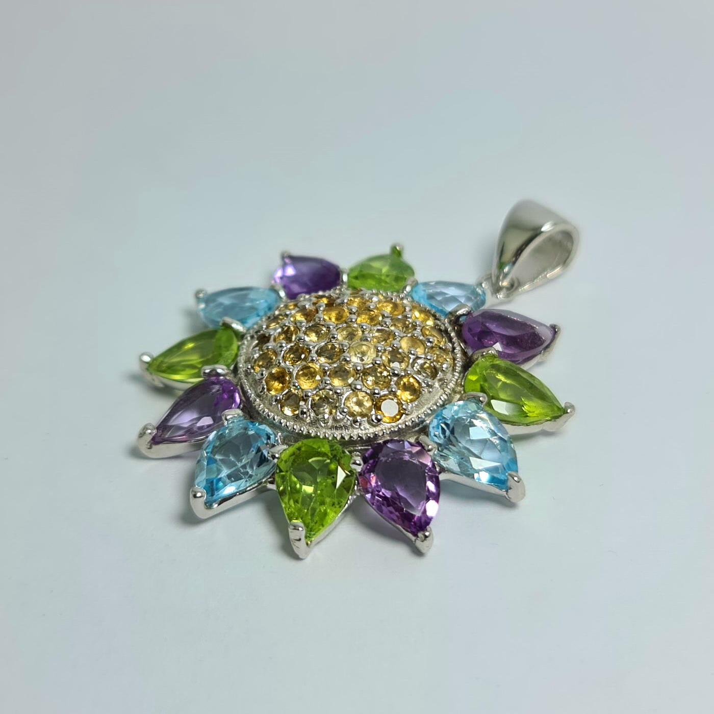 Natural Blue Topaz Peridot Amethyst Citrine Sun Flower Pendant set in Pure .925 Sterling Silver with Rhodium Plating 
Total carat weight : 13 carats