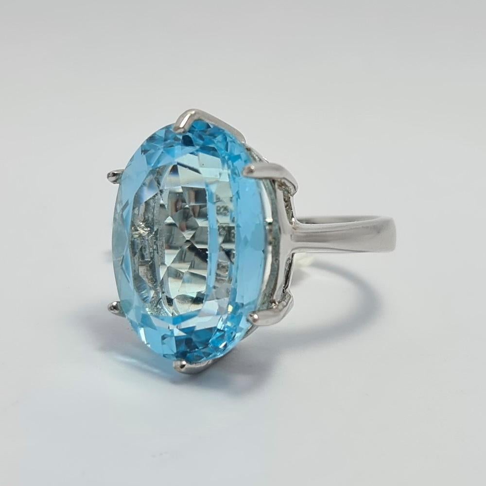 925 Sterling Silver Ring with large natural Blue Topaz Gemstone
The ring size is 6.25 US

The size of the Oval shape Blue Topaz stone is 14×20 mm.
The weight of the Blue Topaz stone is 15 carats
The Ring weighs 10 grams

Please, request your size.