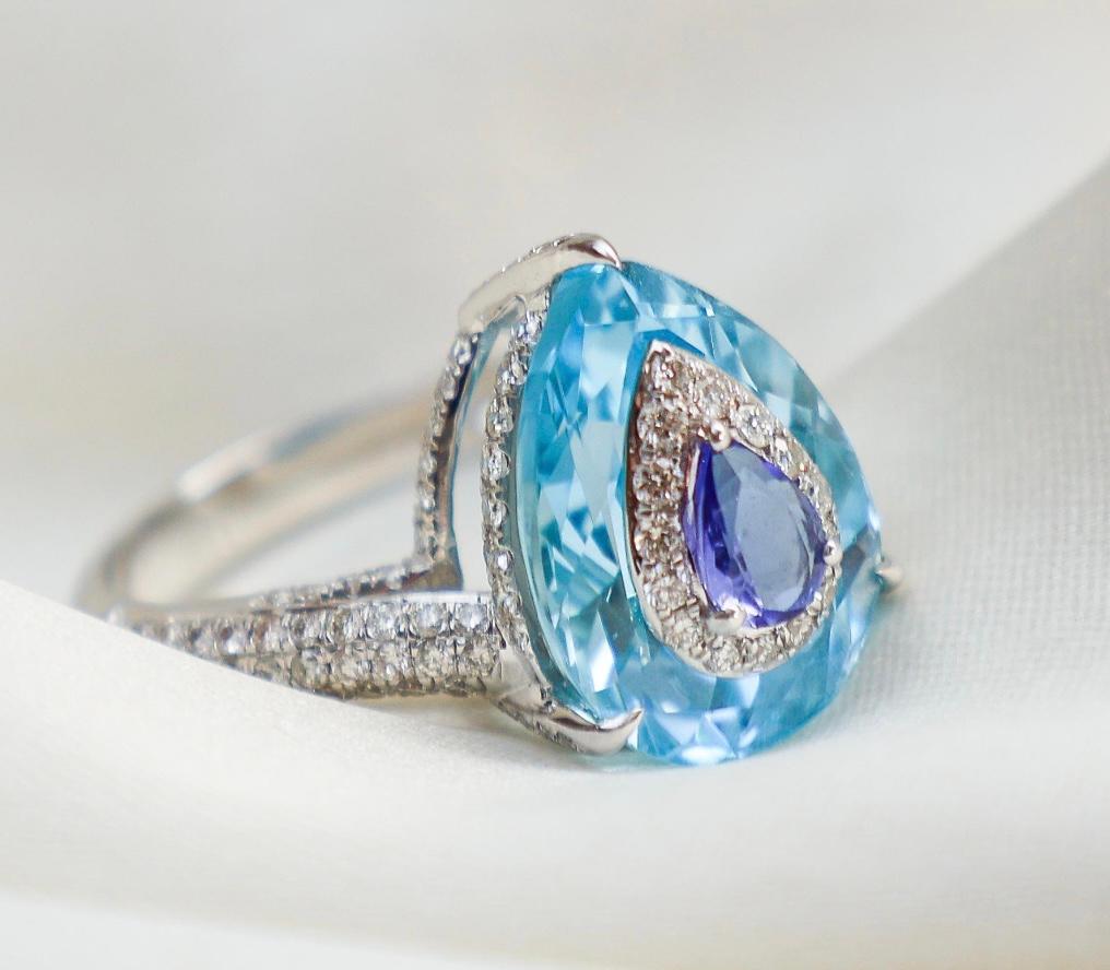 Gemstone : Blue Topaz, Tanzanite

❋ Gemstone Weight : 8.0 Cts, 0.32 Cts

❋ Gemstone Shape : Pear Cut

❋ Gemstone Type : Natural


➡️DIAMOND DETAILS :

❋ Diamond Weight : 0.93 Cts.

❋ Diamond Shape : Round Cut

❋ Diamond Color & Clarity : HI-SI

❋