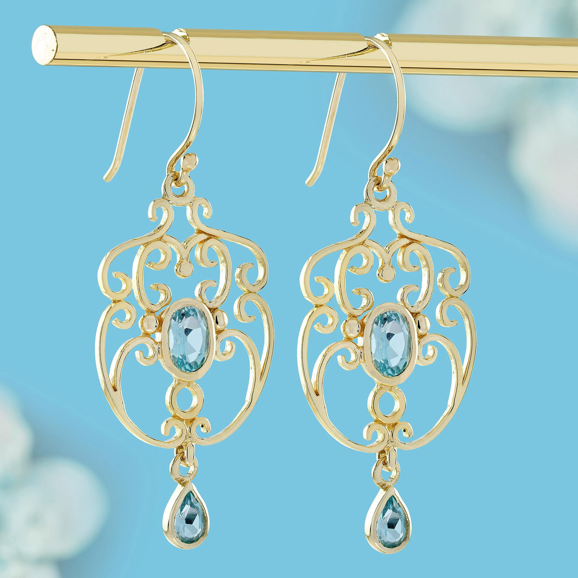 Pendientes colgantes estilo vintage de topacio azul natural en oro macizo de 9 quilates Eduardiano en venta