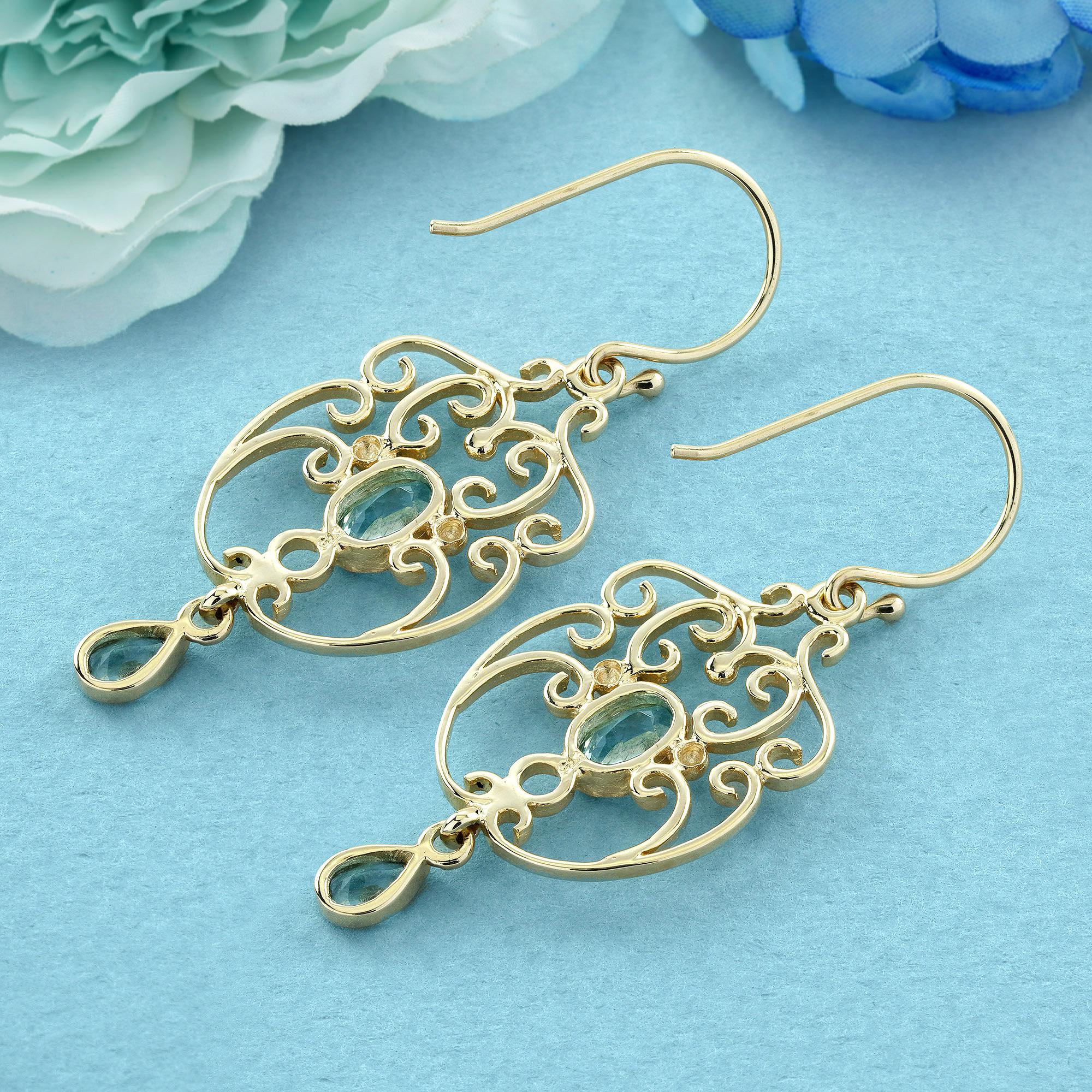 Pendientes colgantes estilo vintage de topacio azul natural en oro macizo de 9 quilates Corte oval en venta