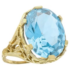 Filigraner Cocktailring aus massivem 9 Karat Gelbgold mit natürlichem blauem Topas im Vintage-Stil