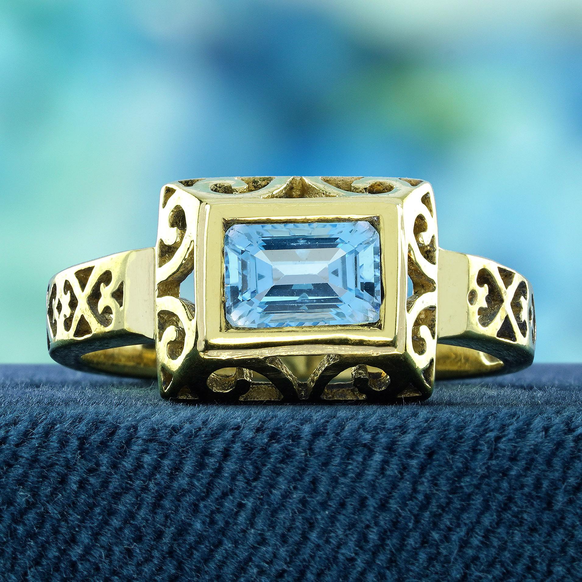 Ajoutez une touche d'élégance et de beauté intemporelle à votre main avec la bague filigranée de style vintage en topaze bleue naturelle en or jaune 9K massif. Le design filigrane complexe est un chef-d'œuvre délicat, offrant un équilibre parfait
