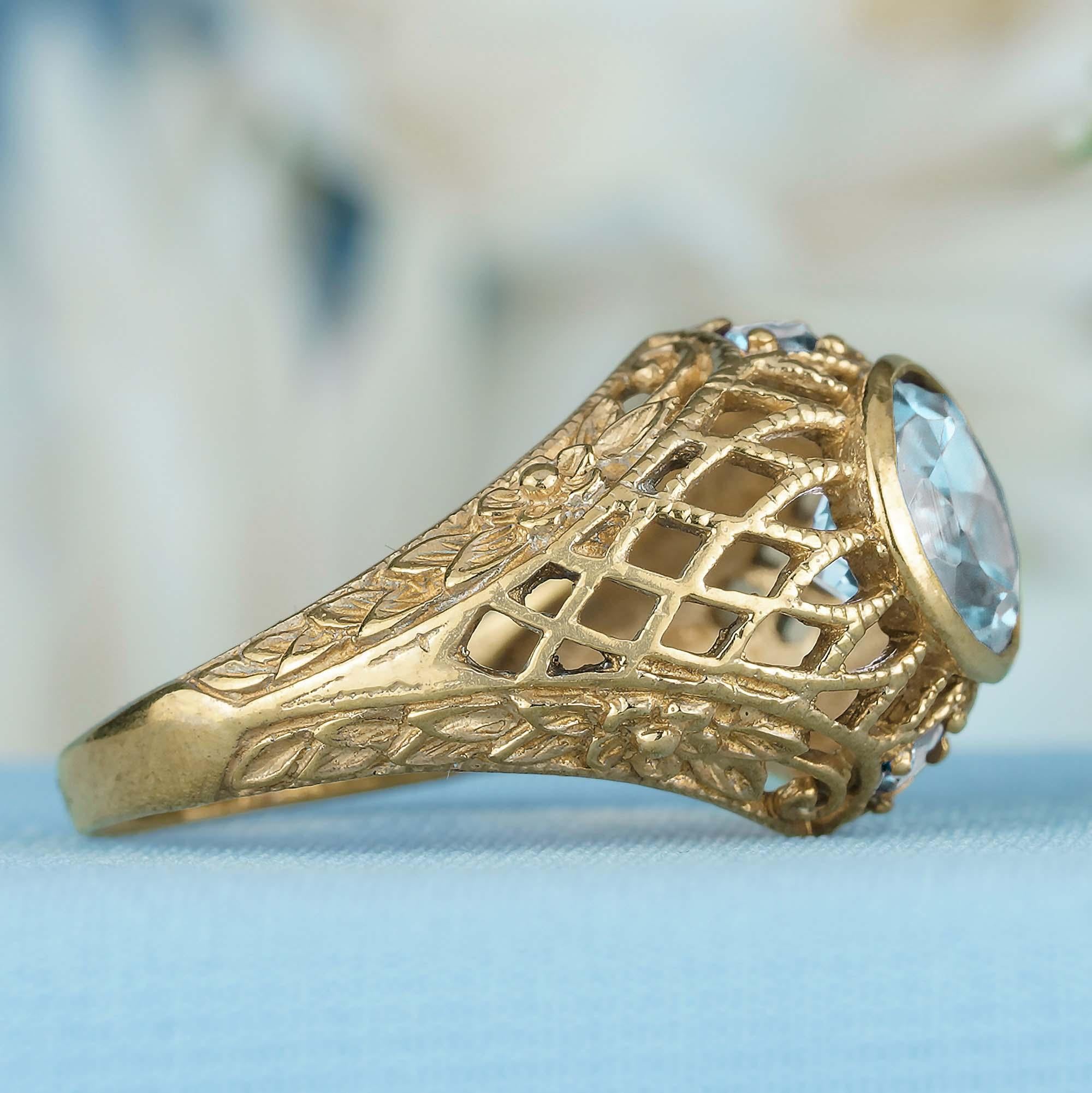 Taille ronde Bague filigrane de style vintage en or jaune massif 9 carats avec topaze bleue naturelle en vente
