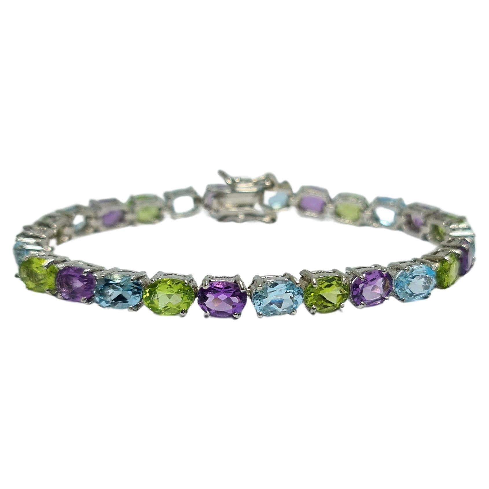 Natural Blue Topaz Amethyst Peridot Tennis Bracelet Set in pure.925 Sterling Silver Rhodium Plated
7 inches 