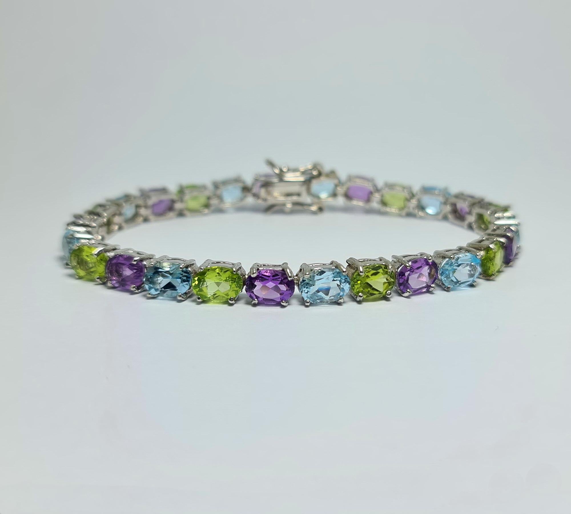 Natural Blue Topaz, Amethyst, Peridot .925 Sterling Silver Rhodium Plate Bracelet In New Condition For Sale In Los Angeles, CA