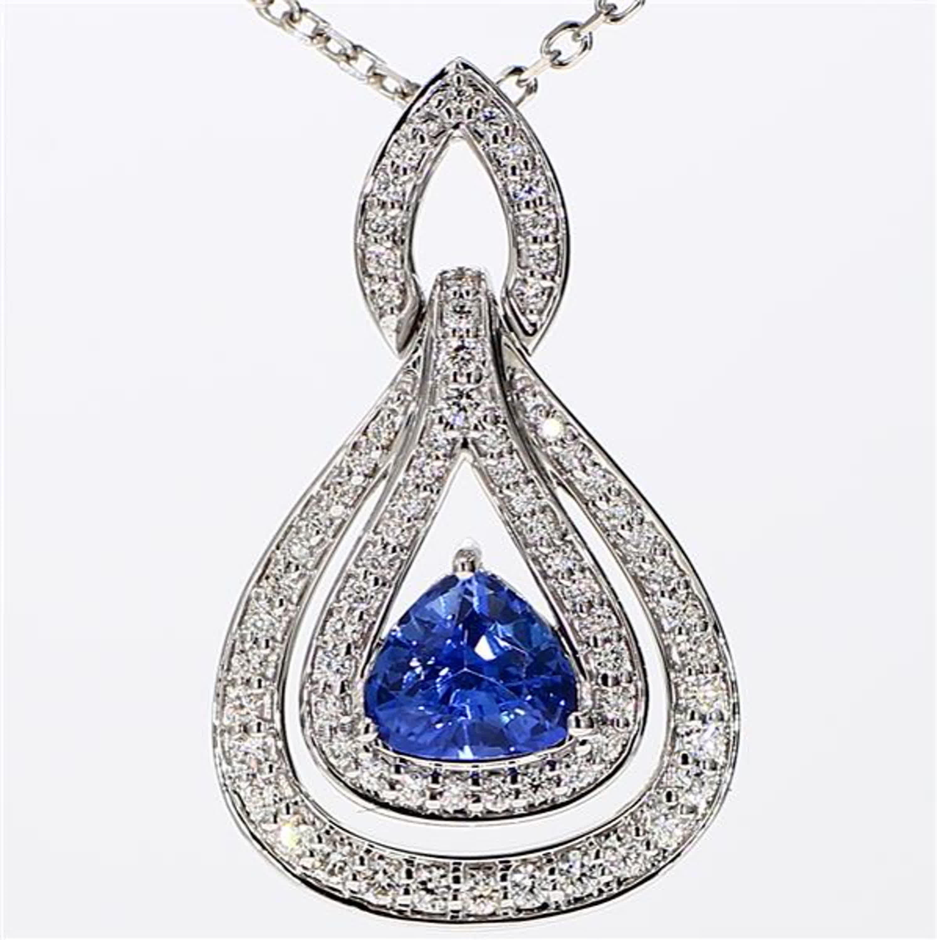 RareGemWorld's classic sapphire pendant. Mounted in a beautiful 18K White Gold setting with a natural trilliant cut blue sapphire. The sapphire is surrounded by natural round white diamond melee. This pendant is guaranteed to impress and enhance