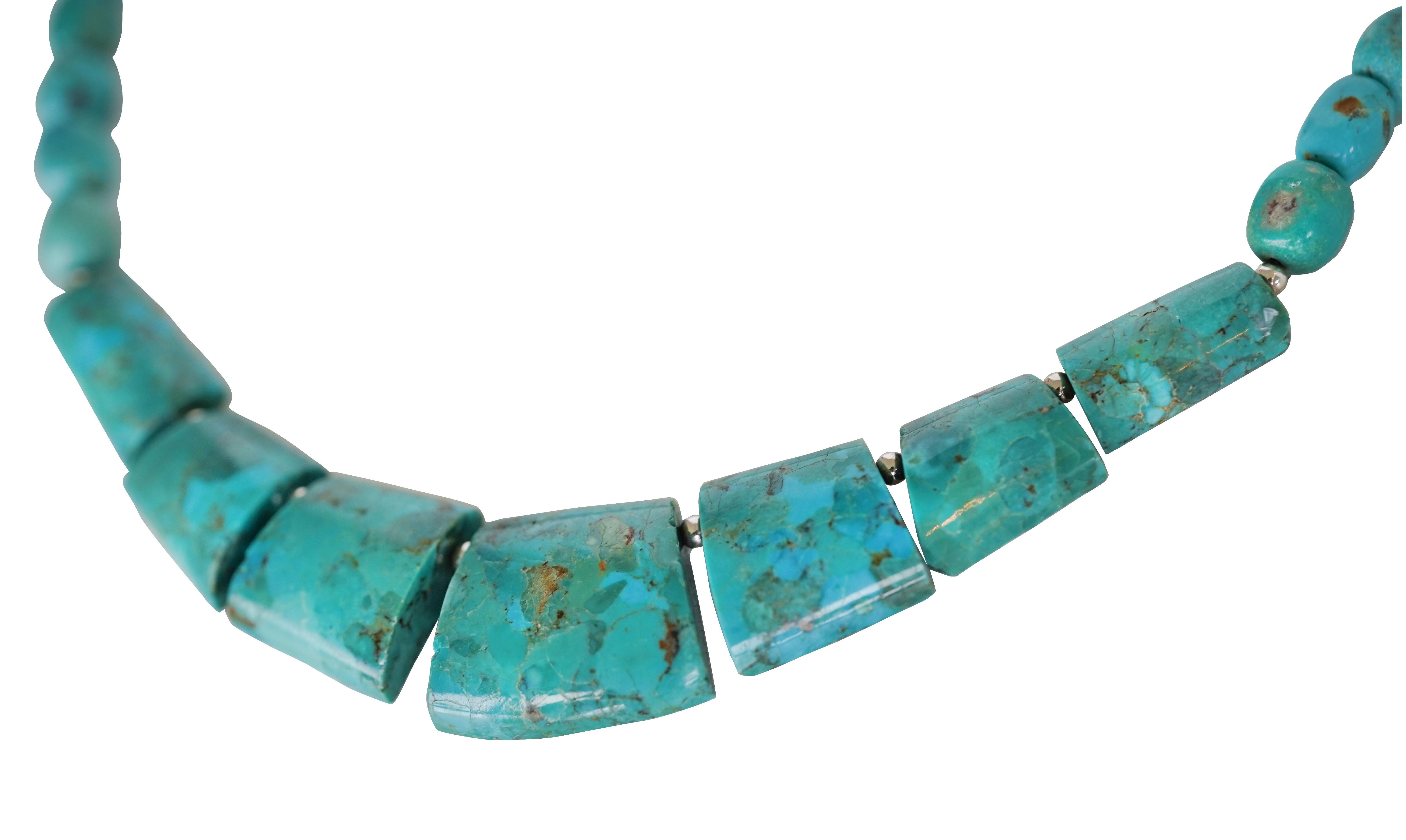 Natural flat blue turquoise bead sterling silver necklace. A total of 7 flat and 30 oval turquoise stones were used to make this necklace.
Necklace length: 19.5 inches/49.5 cm.
Maximum dimensions: 22.43 mm long x 25.55 mm wide, thickness approx. 6