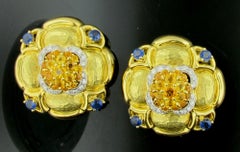 Natural Blue and Yellow Sapphire Earrings Set in 18 Karat Hammered Yellow Gold