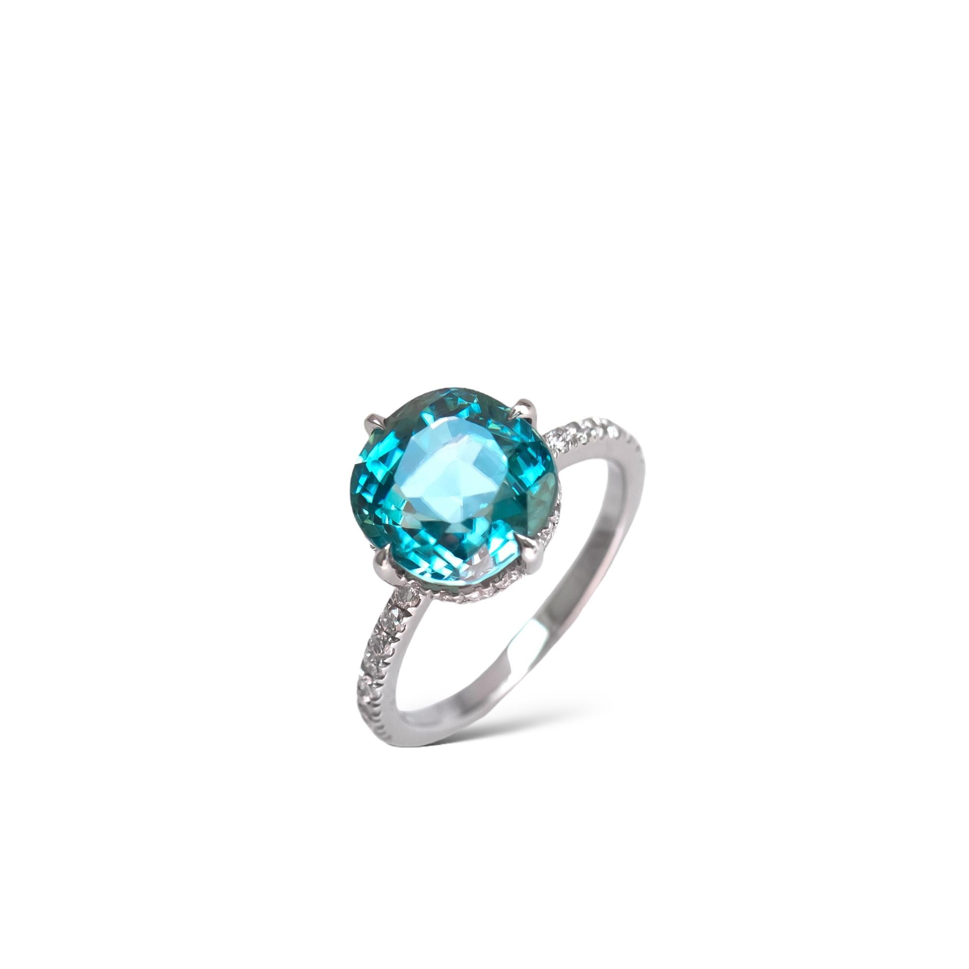 Beautiful natural blue zircon and diamond cocktail ring in platinum.

The zircon is an antique cushion cut with beautiful faceting pattern and will be set in an east-west setting. The zircon weight is 7.20 carat, and it measures 10.36mm x 9.91mm.