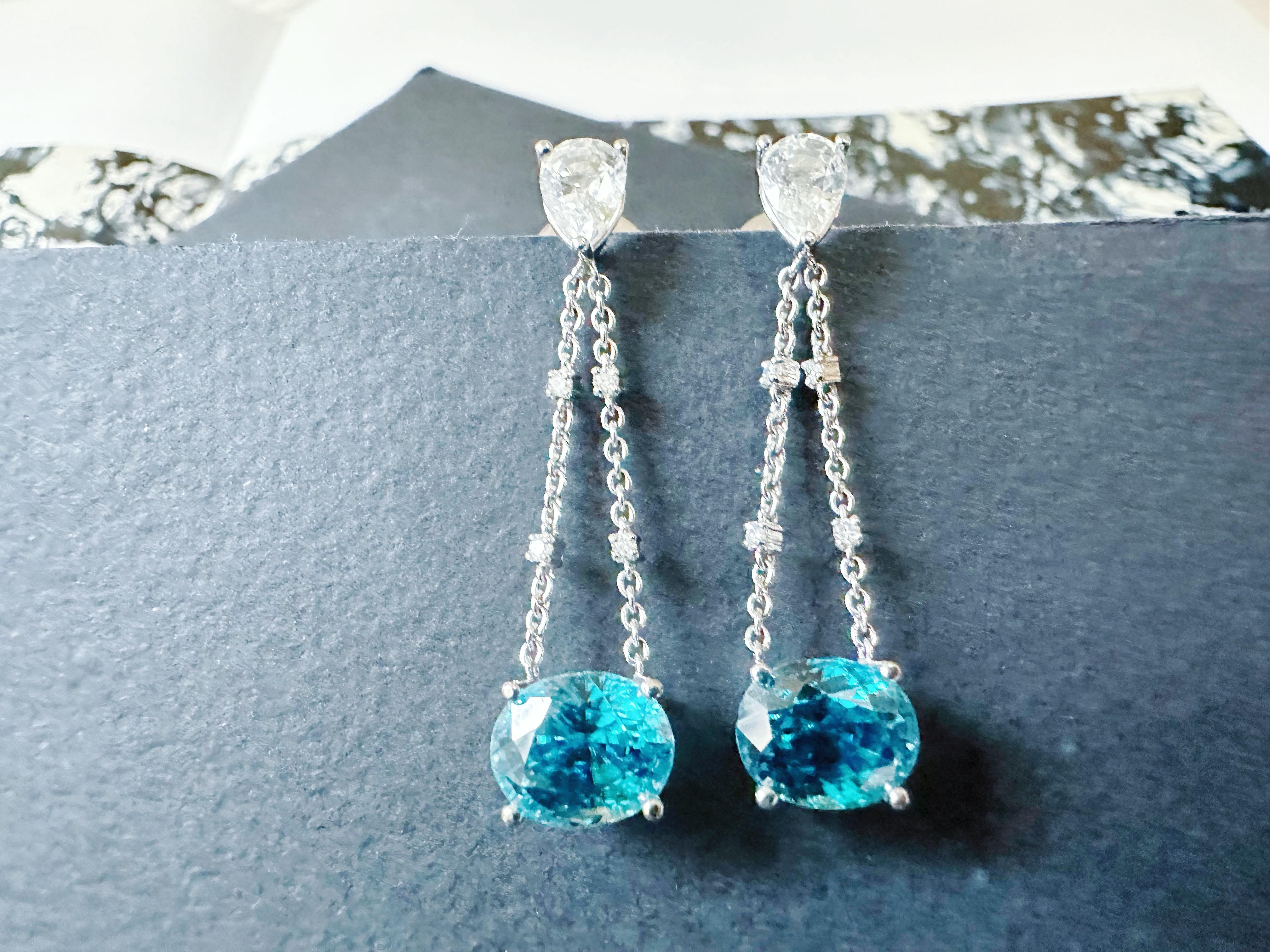 Enhance your jewelry collection with these stunning handcrafted earrings, featuring grade AAA blue zircons and sparkling white sapphires. With a simple and modern design, these luxurious earrings are perfect for everyday wear or special