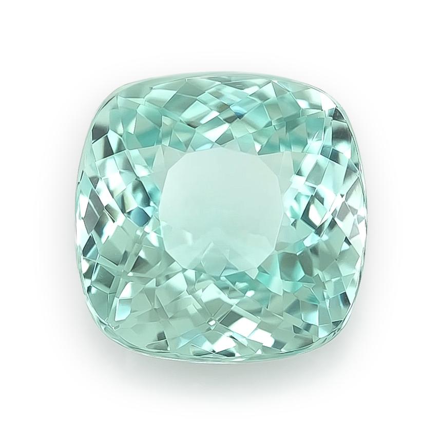 Admire the rare beauty of this natural bluish green Paraiba tourmaline, weighing 3.25 carats. Its glowing hue, cushion shape, and expert modified brilliant cut make this gemstone a striking centerpiece for any fine jewelry design. Accompanied by an
