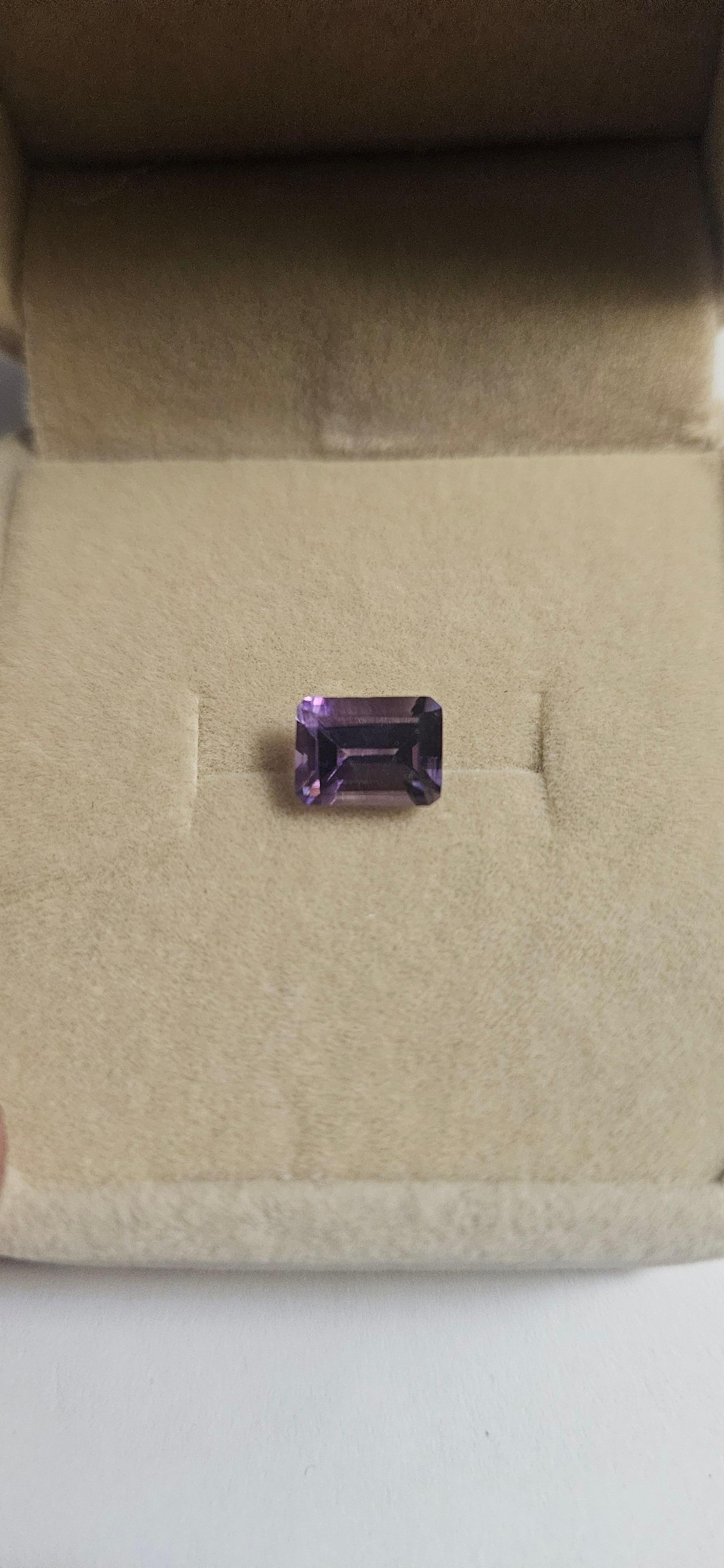 This beautiful amethyst gemstone, weighing 1.5 carats, is perfect for those looking for a high-quality, natural gemstone to add to their collection. The emerald cut shape and 8x6 dimensions make it a stunning addition to any jewelry piece. This