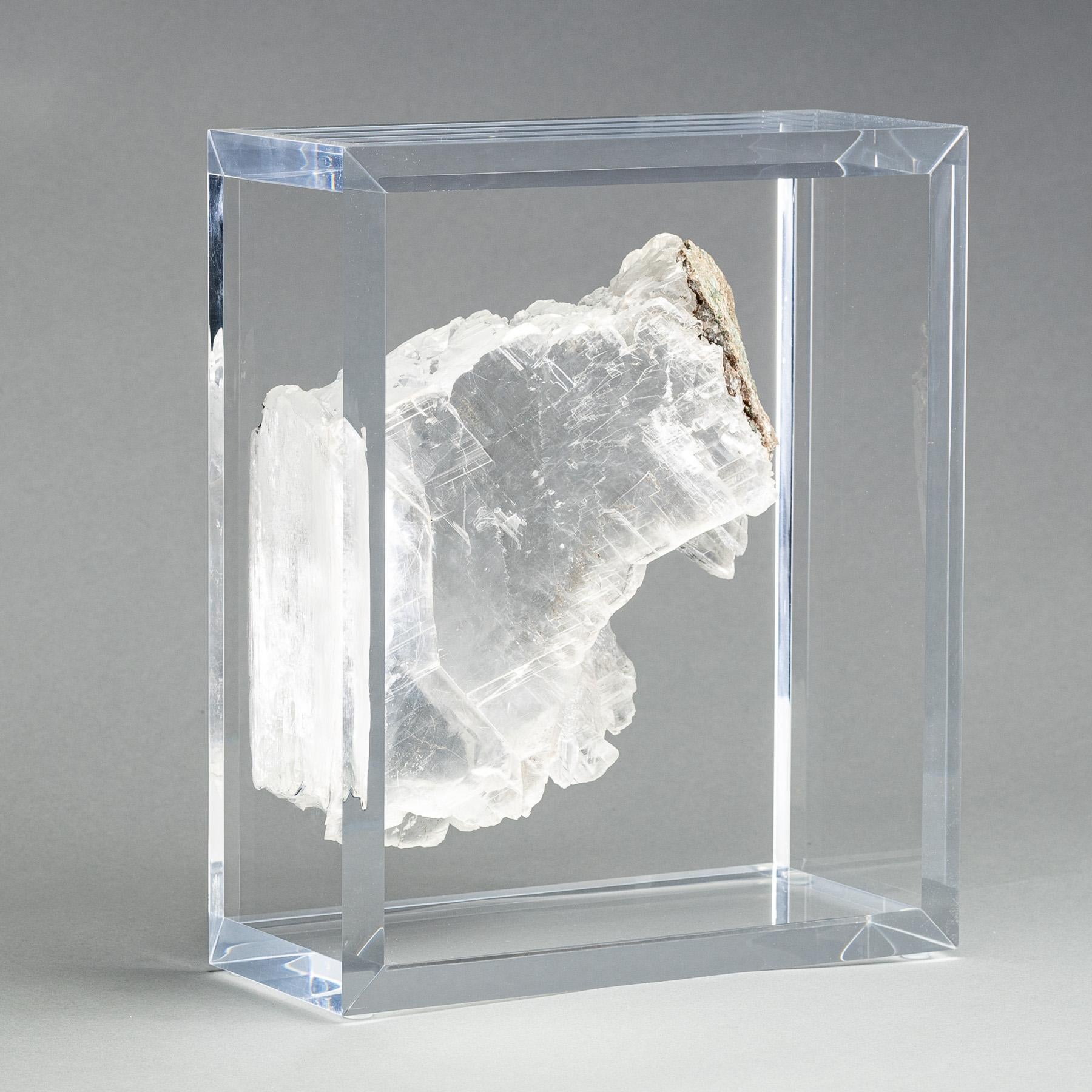 A one of a kind Ice clear selenite specimen from  Rio Grande do Sul, Brazil. With stunning reflective luster and natural lines of growth.  Mounted on  an original design of acrylic box. 


