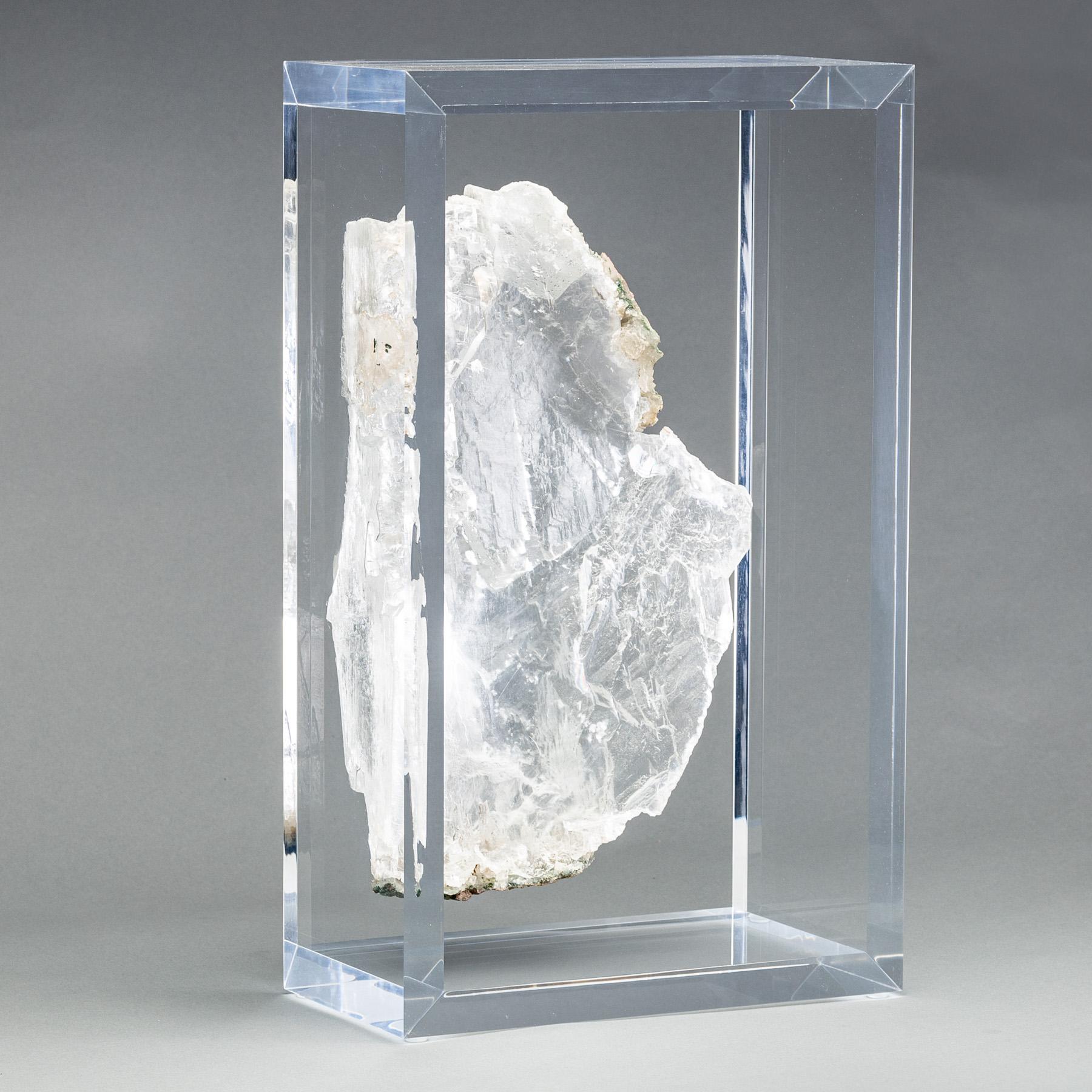A one of a kind Ice clear selenite specimen from  Rio Grande do Sul, Brazil. With stunning reflective luster and natural lines of growth.  Mounted on  an original design of acrylic box. 


